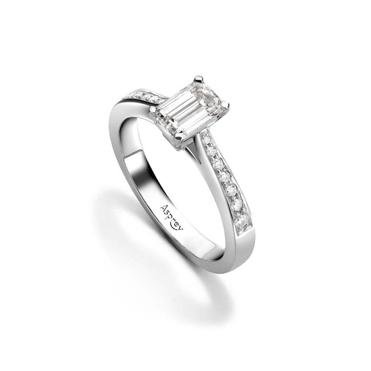 Asprey emerald-cut diamond engagement ring set with round brilliant diamonds on a platinum band (£8,000).